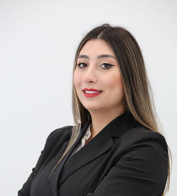 Alaa Hamdoon, Architect, Trojan Property Investment (TPI) - Professional woman in a black blazer smiling confidently against a plain background. Business attire and poised appearance suggest a corporate or formal setting.